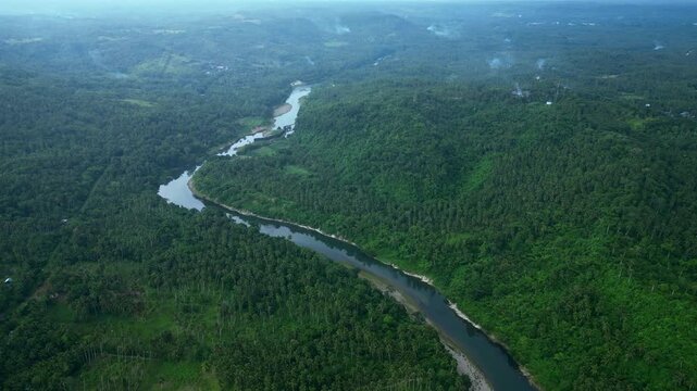 Aerial view of the Libmanan River and surrounding farmland near Sipocot, Camarines Sur, captured at dawn with the bridge toward Yunice Farm and rural agricultural fields visible across the landscape.