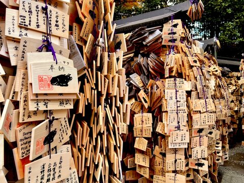 Kyoto city, Japan-December 04 2024 : Closeup Wooden Plate of ema for hope of health, love and prosperity. Ema are small wooden plaques to write prayers, often hanging at shrine, temples in Japan.