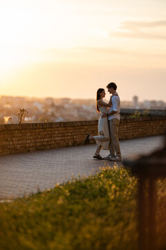 Couple embracing love and romance at golden hour sunset