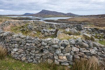 Iron age wheelhouse, near Loch Shornaraigh / Loch Hornaraigh with Eaval in the background, Grimsay, North Uist, Outer Hebrides, Scotland © Quarterland Photos