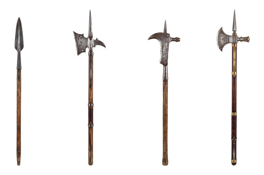 collection of medieval pole weapons with wooden shafts