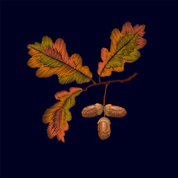 Oak branch with autumn leaves and acorns embroidery design. Nature needlework stitch style. Fashion clothing patches stickers print. Dark blue background hand-stitched vector art.