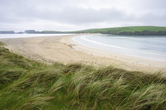 Sandy beach beach and tombolo to St Ninian's Isle on the Shetland Islands, Scotland, Great Britain