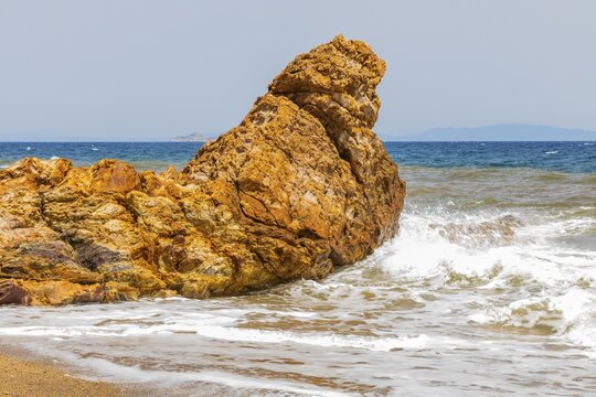 Mineral rock washed by the sea on the beach of Topinetti, near Rio Marina, Elba, Tuscan Archipelago, Tuscany, Italy