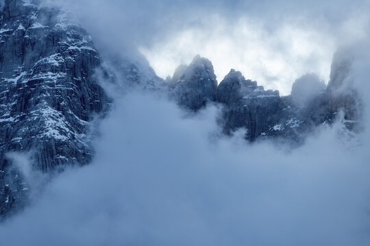 Snowy, cloudy ridge of the Civetta Group, Zoldo Alto, Val di Zoldo, Dolomites, Italy