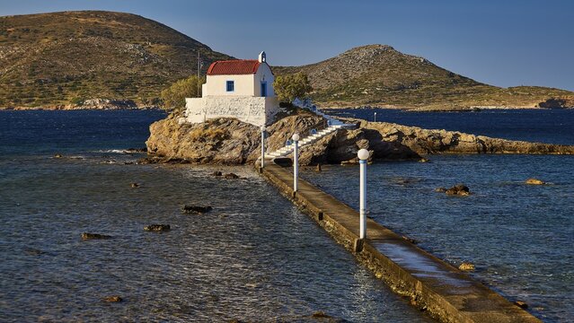 Detailed view of a chapel on a rock in the sea, connected by a long footbridge, chapel, church, Agios Isidoros, rocky islet, Bay of Gourna, Kokkali, Leros, Dodecanese, Greek Islands, Greece
