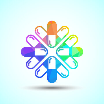 Abstract flower shape composed of rainbow medical capsules for pharmacy branding.