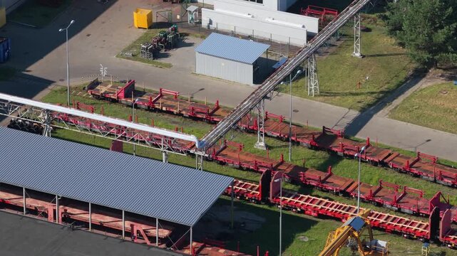 Aerial view of train wagons on siding tracks at an industrial facility