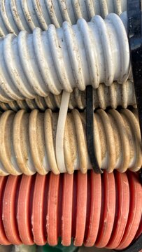 Coiled Plastic Hoses in White and Red