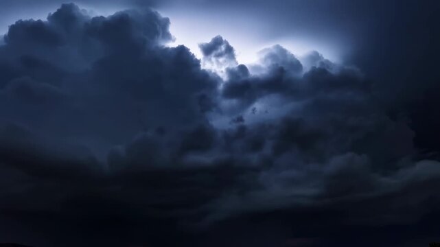 Dramatic storm clouds billow across a twilight sky above an open landscape. Weather forecast programming, severe weather reporting, and meteorology education.