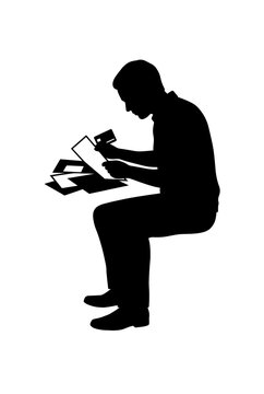 Man sitting and reviewing credit card statements