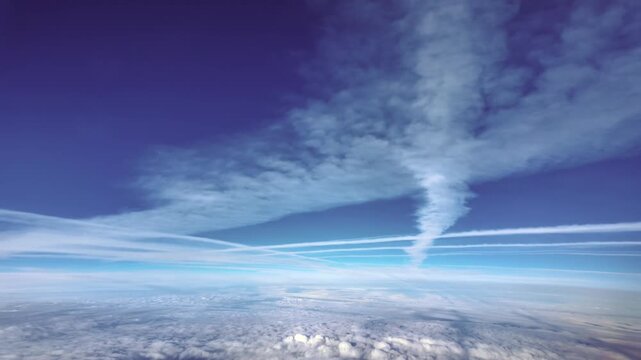 Fast motion shot x5 aerial jet cockpit view of multiple jet fading contrails in a deep blue sky in the upper atmosphere