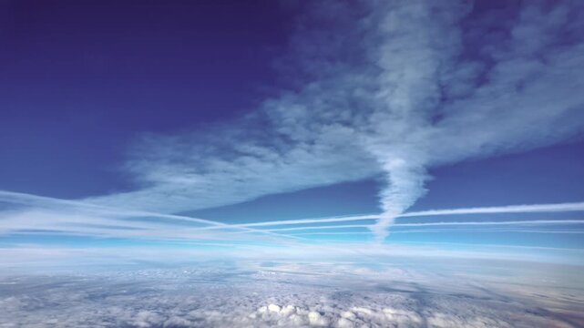 Immersive jet pilot view of multiple crossing contrails in a deep blue sky. Fast motion shot x5.