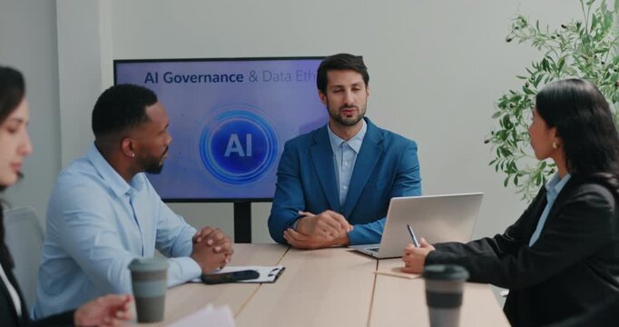 Portrait of Brasilian businessman in blue suit speaks during AI governance meeting with office team. Manager leads discussion and answers questions from team