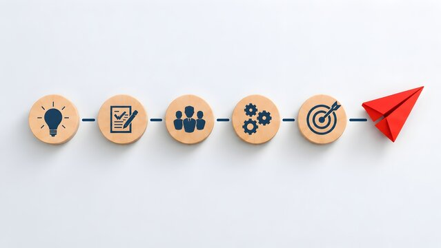 Red paper airplane taking off from sequence of wooden icon blocks representing business workflow from idea generation to project launch and goal achievement