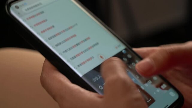 Close-up of hands browsing an online shopping app on a smartphone