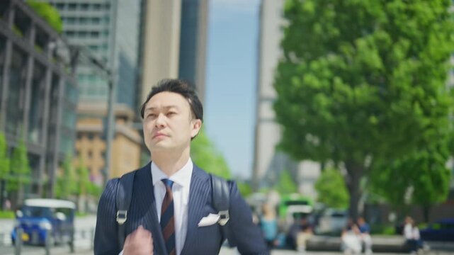 Japanese businessman on his way to work on a spring morning