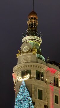 Centro canalejas building in madrid with christmas tree lights at night