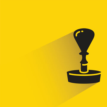 rubber stamper icon with shadow on yellow background