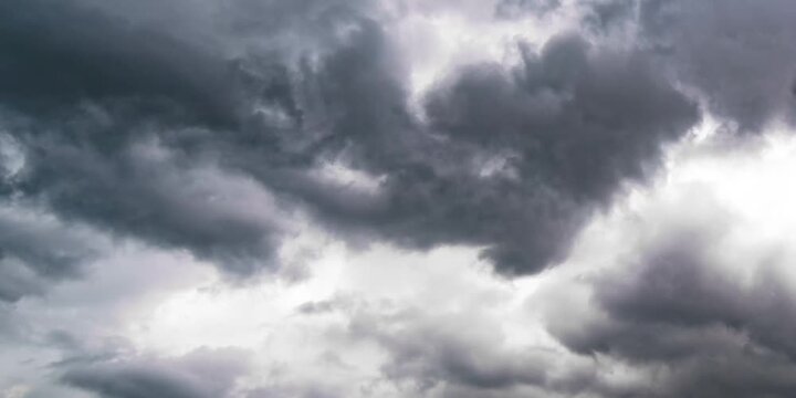 Dramatic dark storm clouds forming in an overcast sky