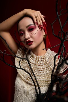 Elegant vampire queen exuding gothic charm in a stunning Halloween look