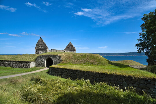 Historic Brahehus Castle Ruin by the Lake in Bright Sunshine.