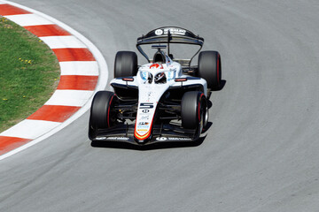 Fototapeta premium May 24, 2026, Montreal, Canada, Esteban Ocon races a Haas F1 car at Circuit Gilles-Villeneuve. g.