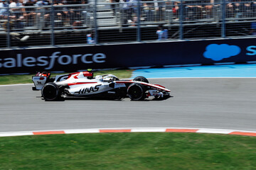 Fototapeta premium May 24, 2026, Montreal, Canada, Esteban Ocon races a Haas F1 car at Circuit Gilles-Villeneuve. g.