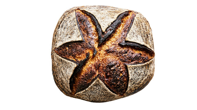 Isolated freshly baked rustic artisan sourdough bread loaf with dark star-scored crust and golden interior.