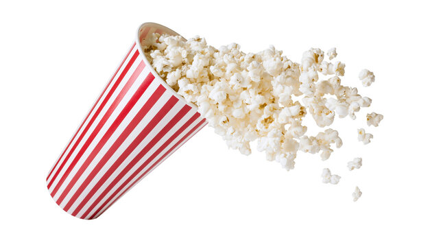 Isolated delicious freshly popped popcorn spilling from a classic red and white striped paper cup.