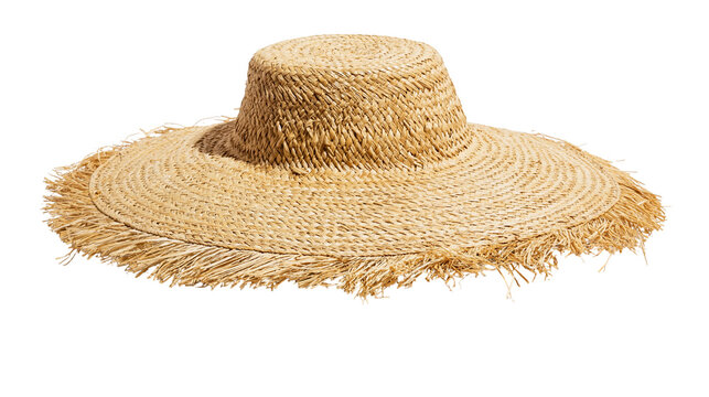 Isolated natural straw sun hat with a wide, fringed brim perfect for summer fashion