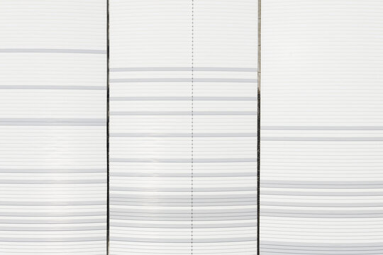Aerial view of the white horizontal lines of a modern building facade in Taiwan.