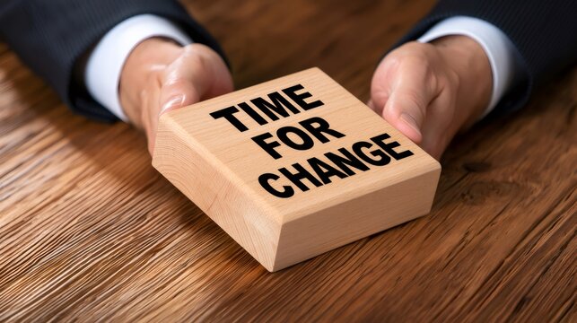 Business hands holding wooden block time for change
