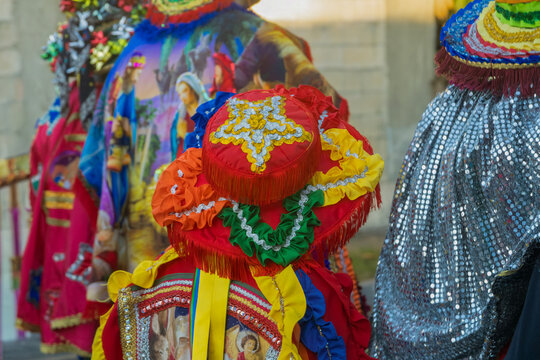 Traditional Puerto Rican Santos Inocentes festival costume with a colorful, embellished hat