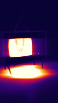 Vintage crt display emitting glowing skull image with vivid floor spotlight in a vertical 3D render