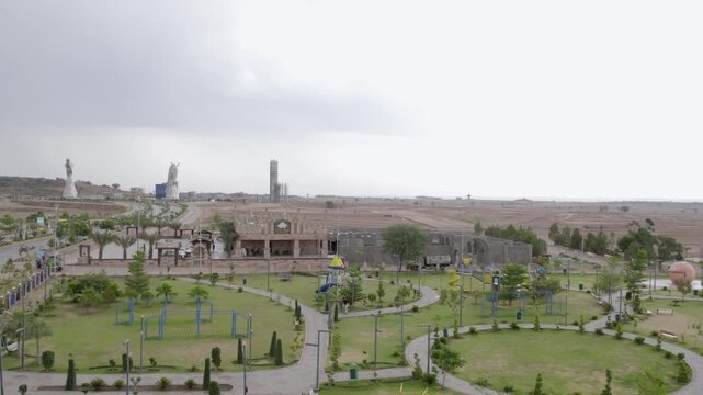 Landscaped garden with paths, lawns and young trees in Capital Smart City, Punjab, Pakistan