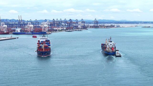 Large container ships sailing in a busy seaport terminal with massive gantry cranes and cargo. Global maritime logistics, international shipping trade, and industrial freight transport operations.