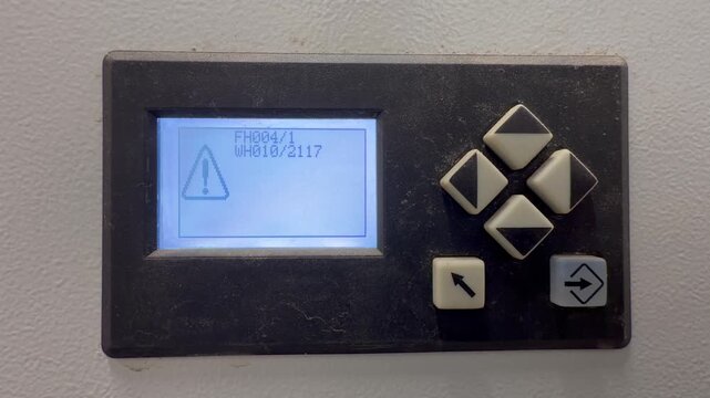 Digital control panel interface featuring six operational buttons with a red light flashing due to a screen system error