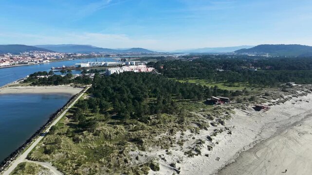 Aerial view of the river flowing into Viana do Castelo, with the city on one side and Cabedelo Beach between the river and the Atlantic Ocean.
