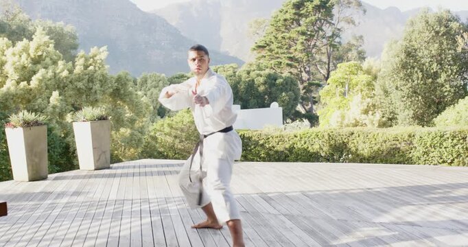 Lifestyle videos outdoor of people doing activities, practicing martial arts, man in karate uniform