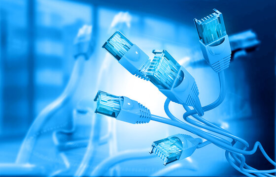 High-speed internet cables connected inside a modern server room with a digital corporate office background.
