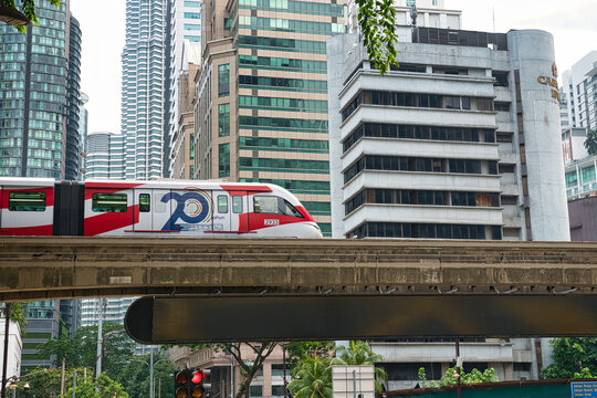 KUALA LUMPUR, MALAYSIA - AUGUST 17, 2026: KL monorail arriving to station Bukit Bintang which is directly in front of Lot 10 Kuala Lumpur Malaysia Shopping Centre in Bukit Bintang. On a hot sunny day 