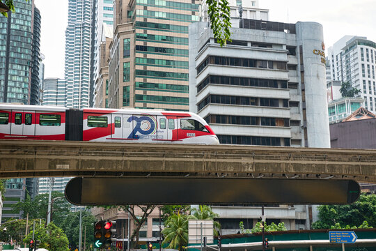KUALA LUMPUR, MALAYSIA - AUGUST 17, 2026: KL monorail arriving to station Bukit Bintang which is directly in front of Lot 10 Kuala Lumpur Malaysia Shopping Centre in Bukit Bintang. On a hot sunny day 