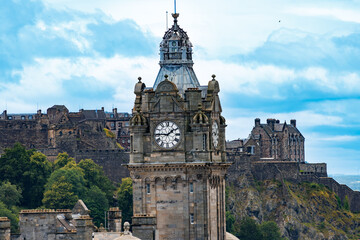 Clock tower of Balmoral hotel and Edinburgh Castle, Scotland © Sergey Novikov
