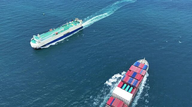 Large roll-on roll-off vehicle carrier and container ship sailing past each other in the deep blue sea. Global maritime logistics, international trade, and commercial freight transport concept.