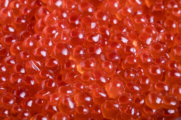 Obraz premium Close-Up of Fresh Salmon Caviar (Ikura) with Vibrant Orange Pearls and Glossy Texture, Premium Japanese Seafood