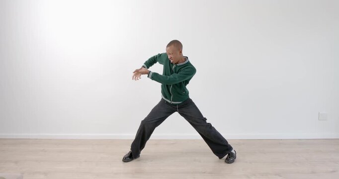 High-speed photography for dynamic scenes, young man in green jacket posing