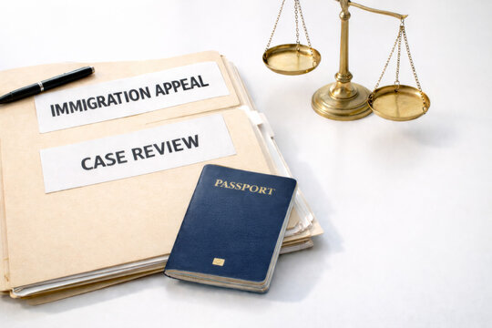 Immigration appeal case review documents with passport and scales, background