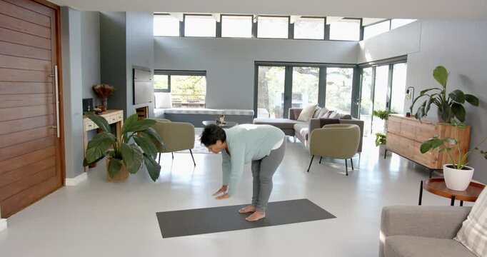 Lifestyle videos indoor of people doing activities at office, practicing yoga, woman doing cobra pos
