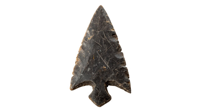 Ancient stone arrowhead weapon artifact isolated on dark background